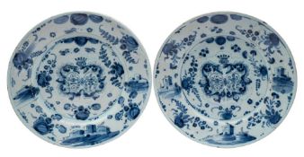 A pair of Italian Savona blue and white maiolica armorial marriage chargers the central double