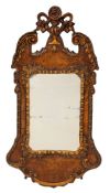 A walnut and parcel gilt framed wall mirror in George I style,