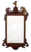 A walnut and parcel giltwood wall mirror in the George II style,
