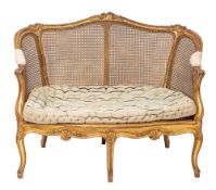 A giltwood and canework settee in Louis XV style,