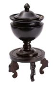A slate urn and cover, 19th century,