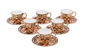 Six Royal Crown Derby porcelain coffee cans and saucers, decorated in the Imari pattern,