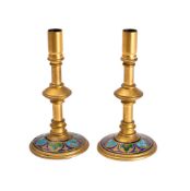A pair of gilt brass and champleve enamel candlesticks, late 19th century,