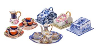 A group of miniature porcelains, comprising a Continental tête a tête and tray,