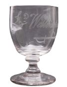 A small toasting glass, the oviform bowl engraved with a sword and the caption 'Ld.