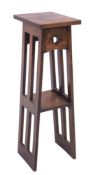 An Arts and Crafts oak stand, possibly Scottish and in the style of Charles Rennie Mackintosh,