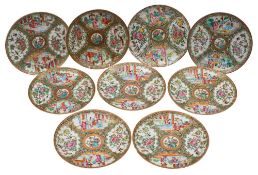 A matched set of nine Canton dishes, Qing Dynasty, 20-21cm [one with minor hair crack].