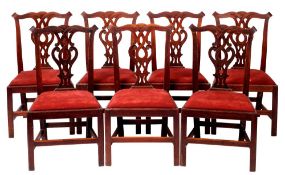 A set of seven George III mahogany dining chairs,