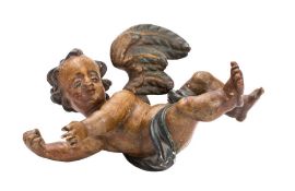 An Italian carved wood and polychrome decorated figure of a cherub: semi-robed with hands held