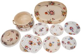 A large mid-19th century English porcelain part dinner service with moulded with scrollwork and
