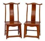 A pair of Chinese stained hardwood yoke back side chairs, in 17th century style,