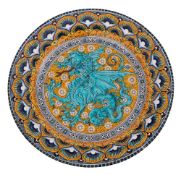 An Italian majolica charger by C Norelli decorated in bright enamels with a dragon medallion within