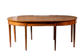 A George III mahogany extending dining table,