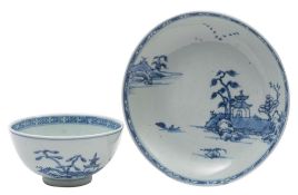A Chinese 'Nanking Cargo' blue and white porcelain saucer dish and a similar bowl both painted with
