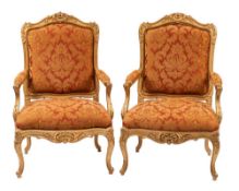 A pair of carved and giltwood and upholstered fauteuils in Louis XV taste,