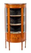 An Edwardian mahogany and glazed bowfront display cabnet, by Edwards & Roberts,