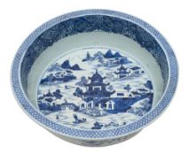 A large Chinese blue and white basin painted with an extensive pagoda lake landscape within an