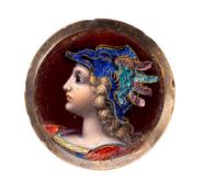A Limoges enamel and gilt metal mounted portrait roundel of a classical warrior,
