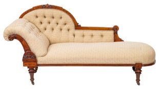 A Victorian walnut and button upholstered chaise longue in Neoclassical style,