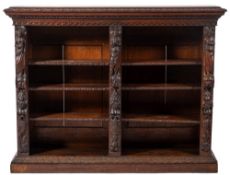 A Victorian carved oak open bookcase in Baroque taste,