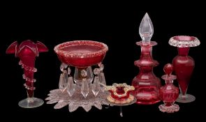 A mixed group of cranberry glass, comprising a footed bowl hunt with pendants, two vases,
