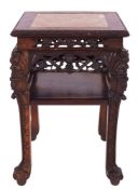 A Chinese carved and stained hardwood and marble mounted stand,