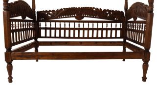 A south east Asian carved and stained wood day bed, in 17th century colonial style,