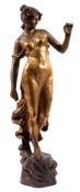 A large Art Nouveau Goldschieder bronzed and gilded terracotta figure of a maiden with flowers in