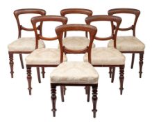 A set of six William IV mahogany 'balloon back' chairs,