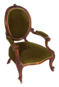 A Victorian walnut and upholstered open armchair,