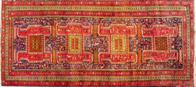A Bidjar Runner, the indigo field with four hooked geometric medallions and all over designs,