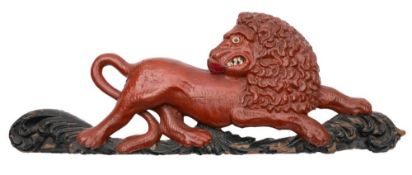 A carved and polychrome painted wood heraldic relief of a lion passant, 19th century,