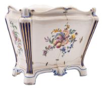 A Sèvres jardiniere of rectangular bombe form with fluted blue and gilt corner columns,