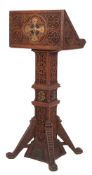 A carved oak and metal mounted lectern, dated 1924, the back and sides of the Book rest,
