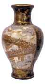 A Japanese satsuma vase decorated with an extensive procession upon a long bridge under cherry