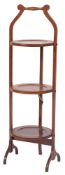 An Edwardian mahogany folding cake stand; early 20th century;