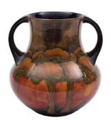 A William Moorcroft twin-handled vase tube lined and decorated in the 'Eventide' pattern with a