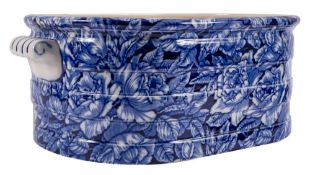 A Blakeney Ironstone foot bath, the exterior transfer decorated with flowers and foliage,