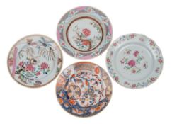 A group of three Chinese famille rose plates and a Chinese Imari plate painted with birds,