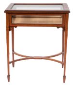 An Edwardian mahogany, crossbanded and glazed table a bijouterie,