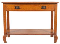 A Victorian oak side or wash table, late 19th century; the top with moulded front and side edges,
