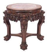 A Chinese carved hardwood and marble mounted stand, late 19th century; of lobed circular section,