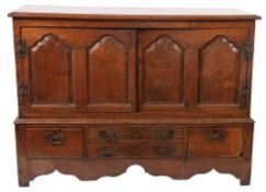 An oak side cupboard,