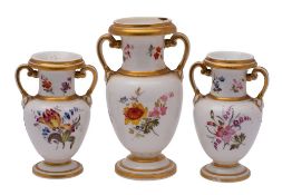 A garniture of three porcelain two handled vases, probably Coalport,