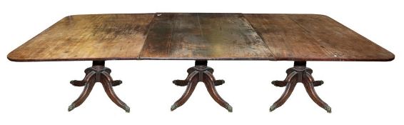 A Regency or George IV mahogany triple pillar dining table,