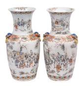 A pair of Chinese famille rose vases of baluster form with waisted necks and Buddhist lion mask