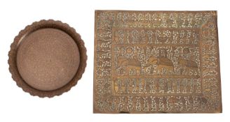 A Burmese rectangular repousse brass tray and a similar engraved circular tray the first decorated