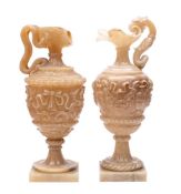 A pair of sculpted alabaster lamps modelled as ewers,