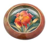 A Moorcroft pin tray the interior and exterior tube lined in the Spring flowers pattern,