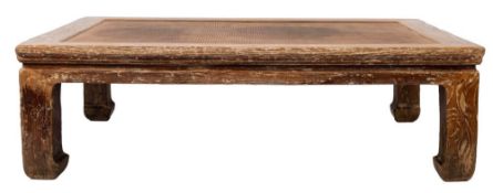 A Chinese hardwood and rattan low table,